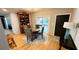 Traditional dining room featuring hardwood floors, modern light fixture, and access to backyard at 954 N Texas Ave, Orlando, FL 32804