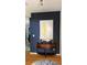 Welcoming entryway with an artful table display and hardwood floors at 954 N Texas Ave, Orlando, FL 32804