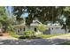 Charming one-story home featuring a unique roofline, mature landscaping, and a well-manicured lawn at 954 N Texas Ave, Orlando, FL 32804