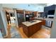 Spacious kitchen with granite countertops, stainless steel appliances, and a center island cooktop at 954 N Texas Ave, Orlando, FL 32804