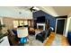 Cozy living room featuring a brick fireplace, hardwood floors, and comfortable seating arrangement at 954 N Texas Ave, Orlando, FL 32804