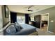 Cozy main bedroom with backyard pool view, a ceiling fan, and a walk-in closet at 954 N Texas Ave, Orlando, FL 32804
