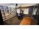 Bright home office featuring custom built-in bookshelves, a ceiling fan, and hardwood floors at 954 N Texas Ave, Orlando, FL 32804