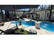 Stunning pool with a screened enclosure, surrounded by lush landscaping and comfortable lounge areas for relaxation at 954 N Texas Ave, Orlando, FL 32804