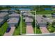 Aerial view of a neighborhood featuring waterfront properties and well-manicured lawns at 9971 Beach Port Dr, Winter Garden, FL 34787