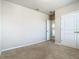 Neutral bedroom with carpet flooring and open closet doors at 9971 Beach Port Dr, Winter Garden, FL 34787