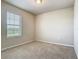 Neutral bedroom with carpet and a window allowing natural light at 9971 Beach Port Dr, Winter Garden, FL 34787