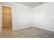 Inviting carpeted bedroom adjacent to a walk-in closet, ready for personalization and comfort at 9971 Beach Port Dr, Winter Garden, FL 34787