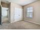 Bedroom featuring neutral colors, carpet, a closet, and window at 9971 Beach Port Dr, Winter Garden, FL 34787