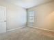 Bedroom featuring neutral colors, carpet, and a window at 9971 Beach Port Dr, Winter Garden, FL 34787