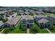 Charming two-story home featuring a well-maintained lawn, complemented by mature trees and manicured landscaping at 9971 Beach Port Dr, Winter Garden, FL 34787