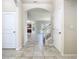 Open foyer showcasing tile flooring that leads to other areas of the home, with a view of the stairs at 9971 Beach Port Dr, Winter Garden, FL 34787