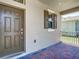 Welcoming front porch with a brick floor, providing a cozy entrance to the home at 9971 Beach Port Dr, Winter Garden, FL 34787