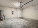 Spacious garage with concrete block wall and sealed concrete floors at 9971 Beach Port Dr, Winter Garden, FL 34787