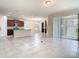A well lit kitchen with granite countertops, stainless steel appliances, and tile flooring at 9971 Beach Port Dr, Winter Garden, FL 34787