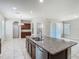 Kitchen island features a granite countertop, sink and stainless steel dishwasher at 9971 Beach Port Dr, Winter Garden, FL 34787