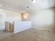 Open loft area featuring neutral paint, plush carpet, and natural light from a window at the top of the stairs at 9971 Beach Port Dr, Winter Garden, FL 34787