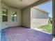 A covered patio with brick pavers provides a relaxing outdoor space with natural light at 9971 Beach Port Dr, Winter Garden, FL 34787
