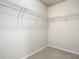 Spacious walk-in closet is equipped with wire shelving for optimal organization at 9971 Beach Port Dr, Winter Garden, FL 34787