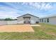 A spacious backyard features a brick patio and a well-maintained lawn at 1050 20 St, Orlando, FL 32805