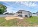 Spacious backyard with a brick patio and a well-maintained lawn and fence at 1050 20 St, Orlando, FL 32805
