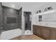 Modern bathroom featuring a double vanity, soaking tub, and separate walk-in shower at 1050 20 St, Orlando, FL 32805