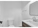 Modern half bathroom featuring a sink, toilet, and mirror with sleek fixtures and contemporary design at 1050 20 St, Orlando, FL 32805