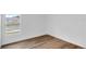 This is a simple bedroom featuring a window and vinyl floors at 1050 20 St, Orlando, FL 32805