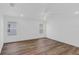 Bright bedroom is complete with two large windows and wood-look flooring at 1050 20 St, Orlando, FL 32805