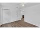 Bright bedroom boasts wood-look floors, a ceiling fan, and a closet for storage at 1050 20 St, Orlando, FL 32805