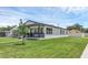 A cozy single Gathering house with a well-kept lawn and a charming front porch at 1050 20 St, Orlando, FL 32805