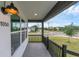 Charming front porch with a view of the street and manicured green lawn at 1050 20 St, Orlando, FL 32805