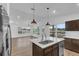 Kitchen island in an open floor plan view, showcasing living room and outside the window at 1050 20 St, Orlando, FL 32805