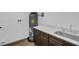 A laundry room offers a modern sink, cabinets, and updated hot water heater at 1050 20 St, Orlando, FL 32805