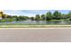 Scenic pond view with lush greenery, complemented by a smooth asphalt road at 1050 20 St, Orlando, FL 32805