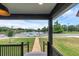 Scenic view from the front porch of a charming home, overlooking a serene lake at 1050 20 St, Orlando, FL 32805