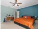 This is a comfortably decorated bedroom with modern furniture and a soothing color scheme at 1064 Universal Rest Pl, Kissimmee, FL 34744