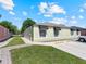 Charming single story home with a well-manicured lawn and black awnings, offering a welcoming curb appeal at 1064 Universal Rest Pl, Kissimmee, FL 34744
