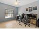 A bright home office with a window and two workstations for maximum productivity at 1064 Universal Rest Pl, Kissimmee, FL 34744