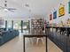 Open living space with a large dining table and ample shelving, creating an inviting and functional area at 1064 Universal Rest Pl, Kissimmee, FL 34744