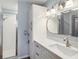 Bathroom features a large vanity, shower, updated lighting, and plenty of storage at 1111 High Vista Dr, Davenport, FL 33837