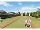 Well-kept bocce ball court for a relaxing outdoor game, complete with seating at 1111 High Vista Dr, Davenport, FL 33837