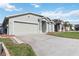 Charming single-Gathering home with a long driveway and two-car garage in a neighborhood setting at 1111 High Vista Dr, Davenport, FL 33837