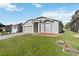 Inviting home with a lush front lawn and convenient two-car garage in a peaceful neighborhood at 1111 High Vista Dr, Davenport, FL 33837