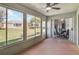 Enclosed lanai with sliding glass door and expansive views of the backyard at 1111 High Vista Dr, Davenport, FL 33837