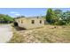 Backyard view of home with grassy area at 1125 Emerald Dr, Mount Dora, FL 32757
