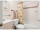 Cozy bathroom with shower-tub combo, patterned shower curtain and classic fixtures at 1125 Emerald Dr, Mount Dora, FL 32757