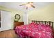 Spacious bedroom features two closets, updated ceiling fan and tv at 1125 Emerald Dr, Mount Dora, FL 32757