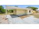Single-story home featuring a convenient carport, well-maintained lawn, and simple landscaping at 1125 Emerald Dr, Mount Dora, FL 32757