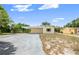 Welcoming single-story home featuring a convenient carport, tidy landscaping, and a long driveway at 1125 Emerald Dr, Mount Dora, FL 32757